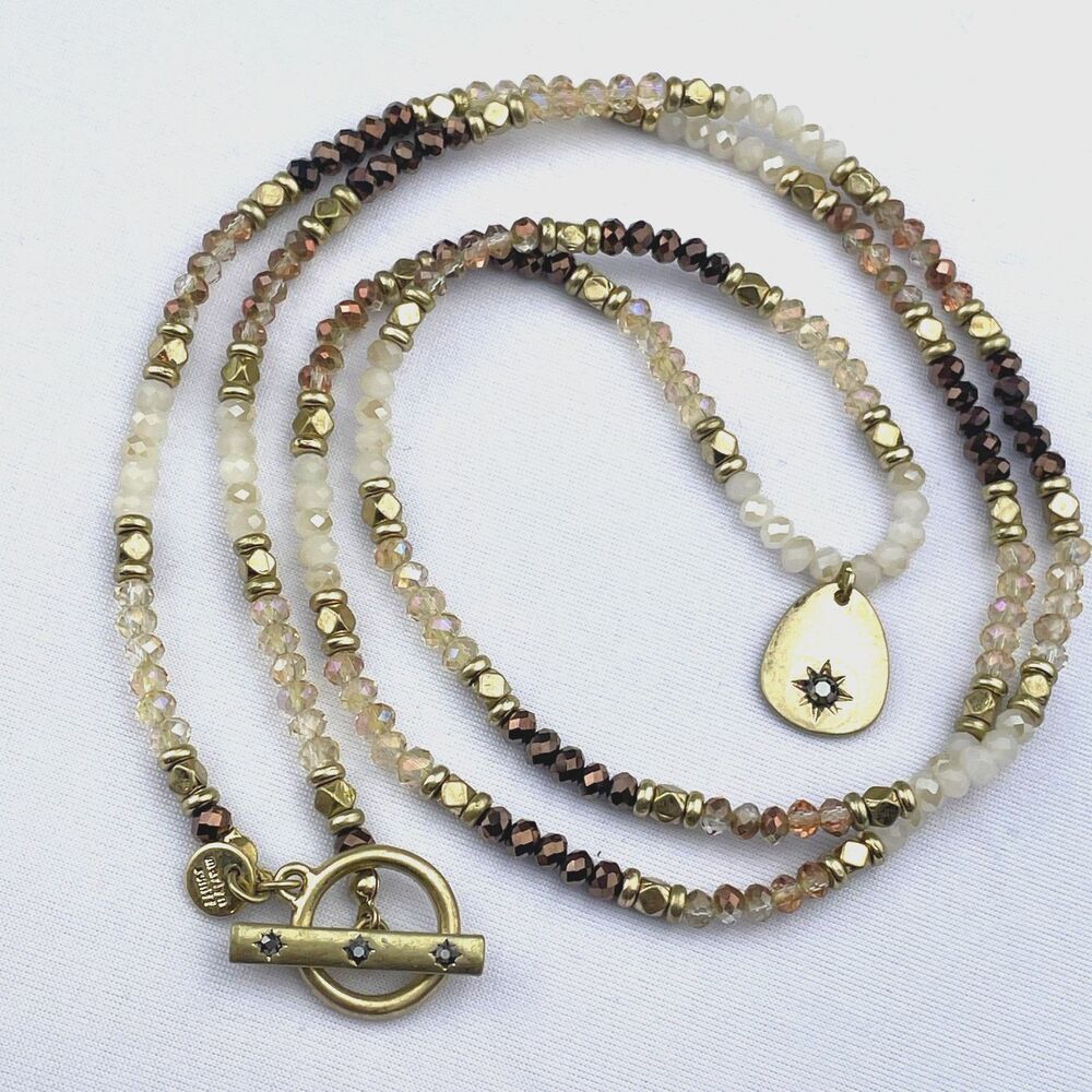 ~ Marlyn Schiff Necklace Beaded Gold Star 2-sided Crystals Neutral Brown Ivory